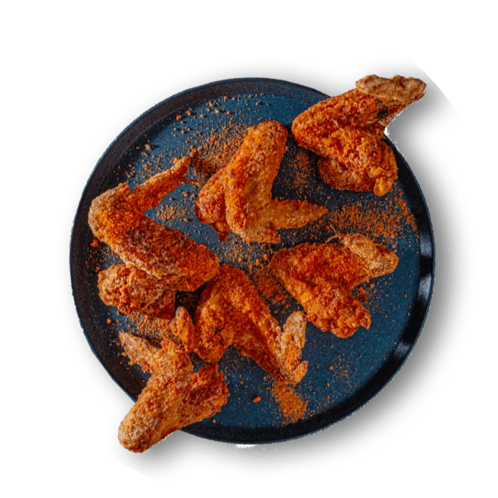A plate of wings deep fried and covered in yaji powder